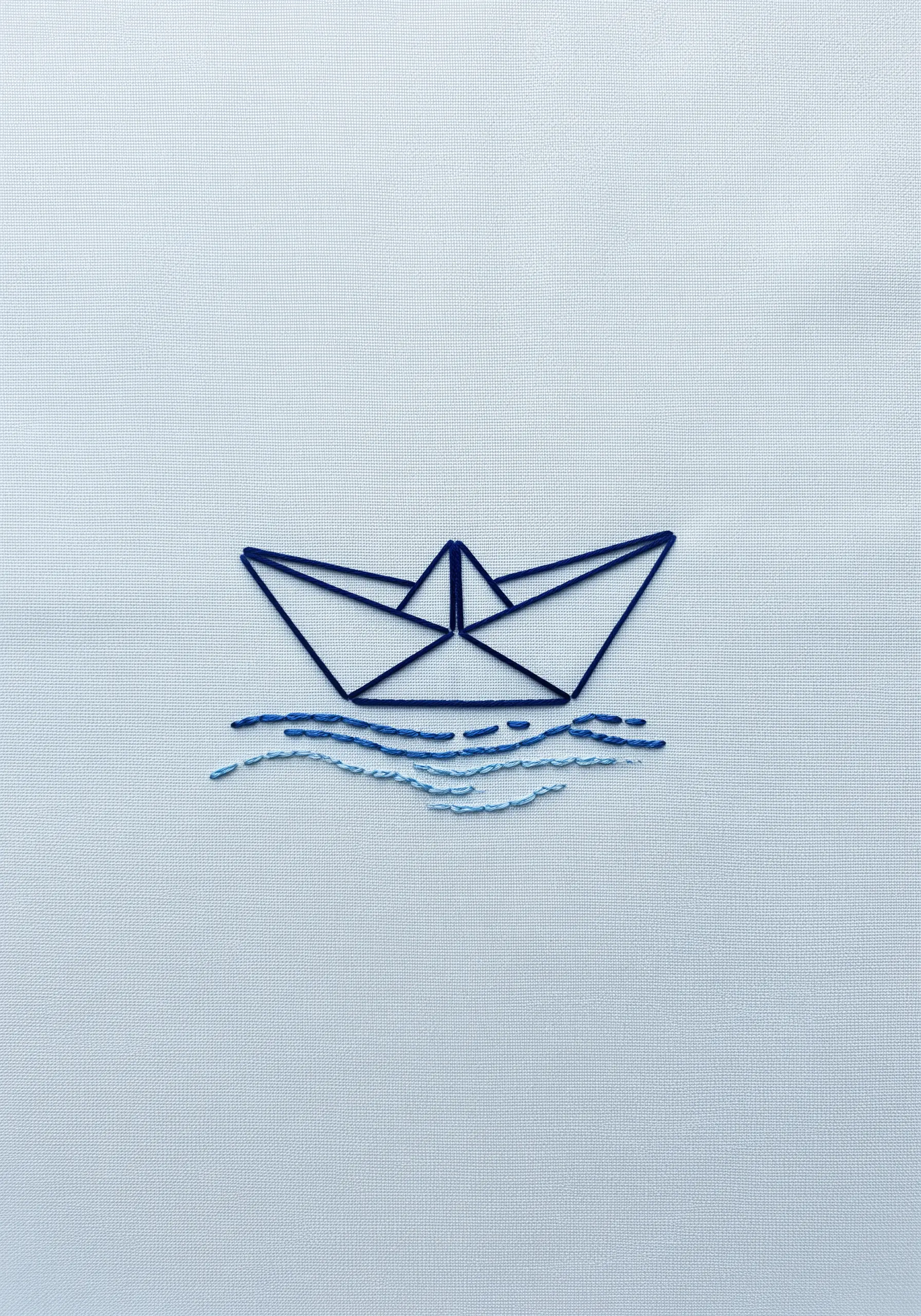 A minimalist paper boat outlined in dark blue, floating on light blue waves.