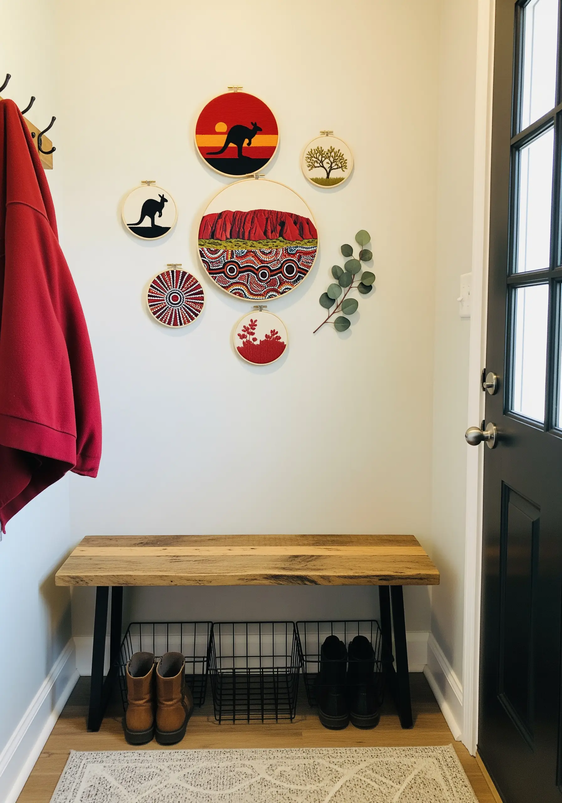 A collection of Australian-themed embroidery hoops featuring Uluru, a kangaroo, and dot patterns.