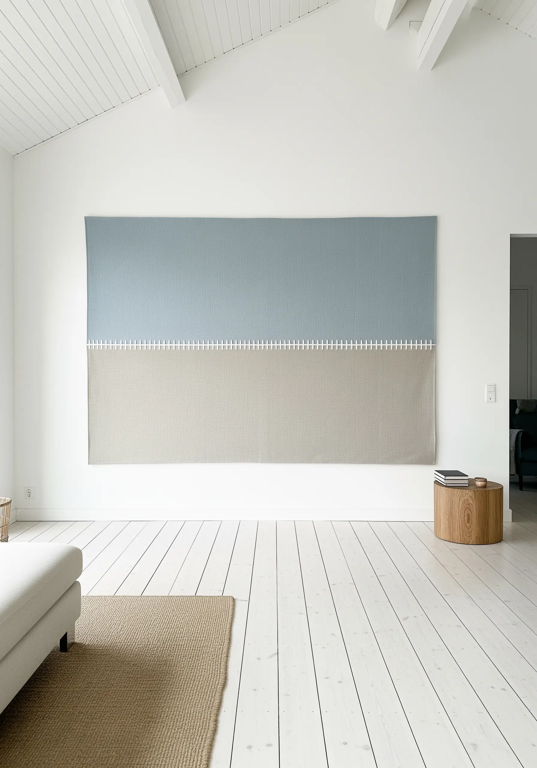 A large textile wall hanging of two color-blocked panels joined by a visible white stitch.