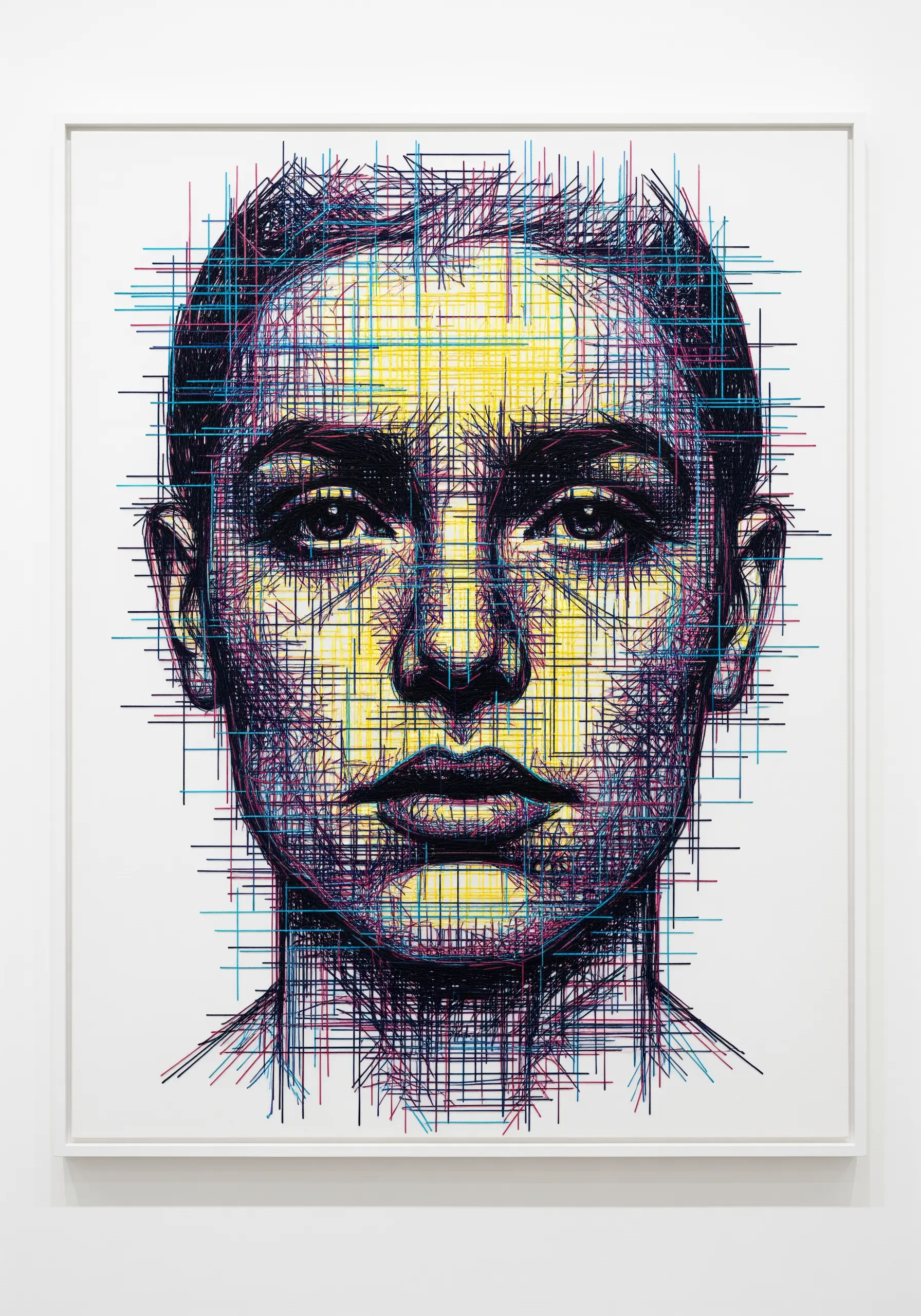 Embroidered face portrait with colorful digital glitch effects