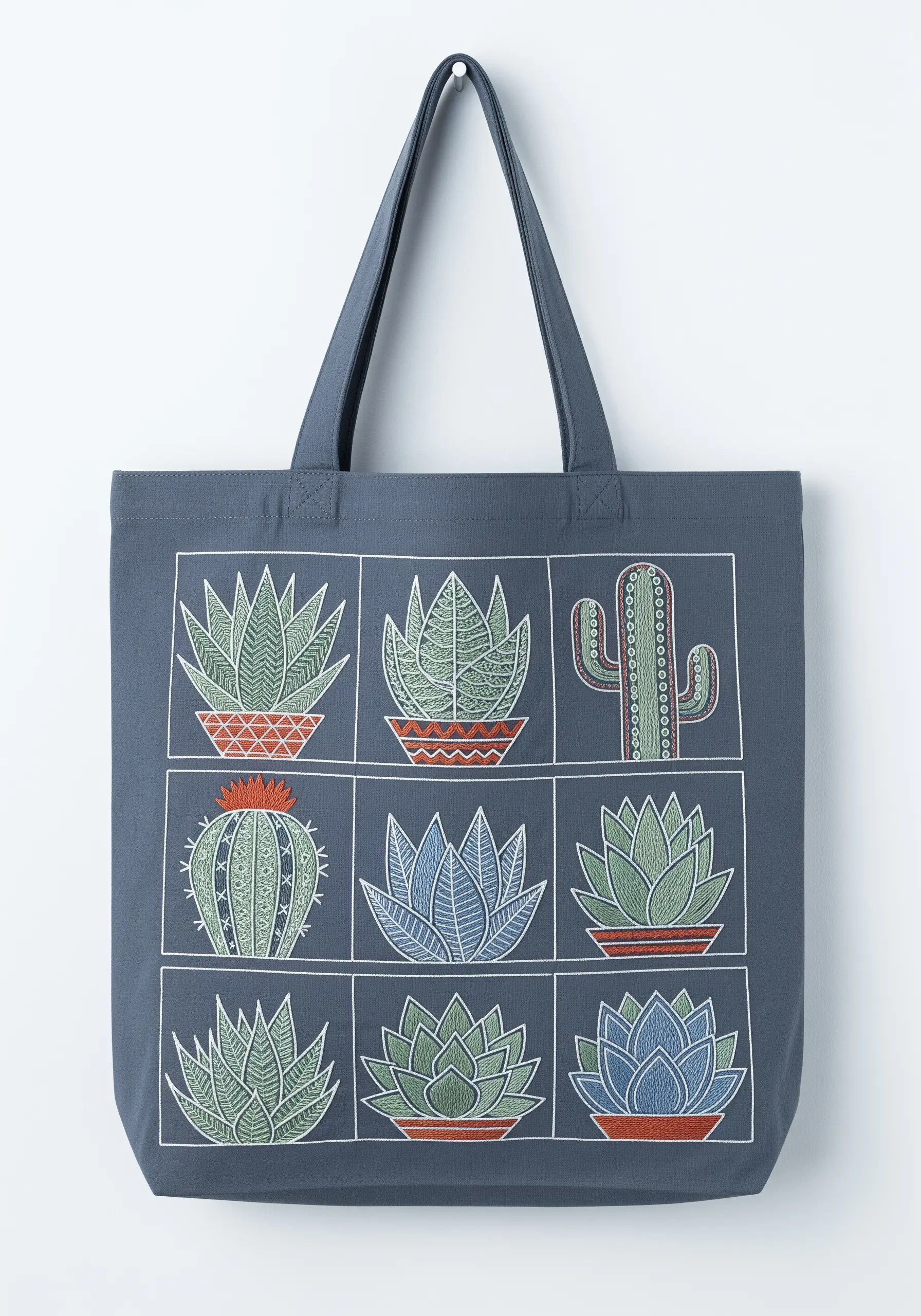 A grid of nine embroidered succulents and cacti in a modern sampler style.