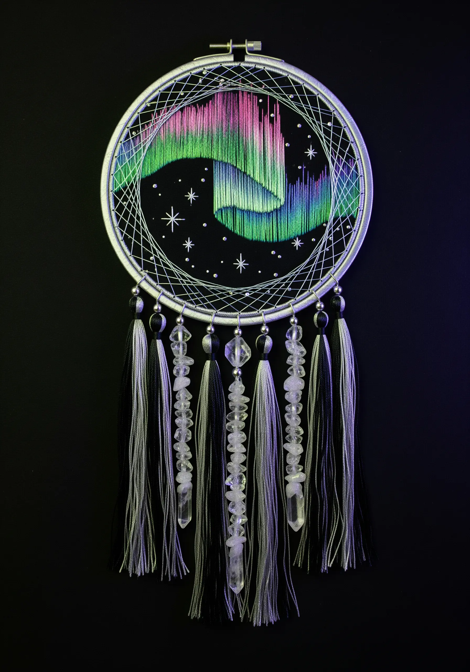 Dreamcatcher depicting the Northern Lights with blended satin stitch and crystal tassels.