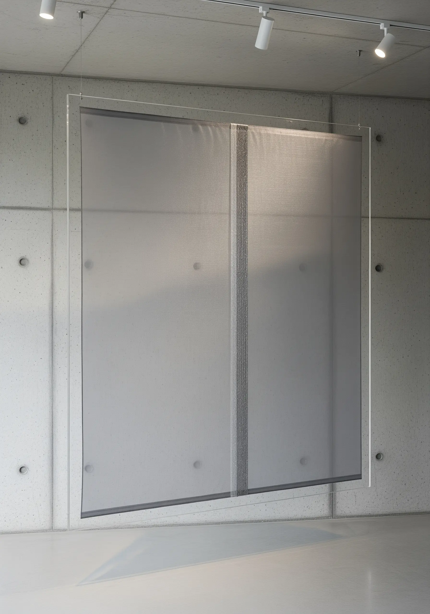 A sheer fabric panel suspended in an acrylic frame with a single vertical line of stitching.