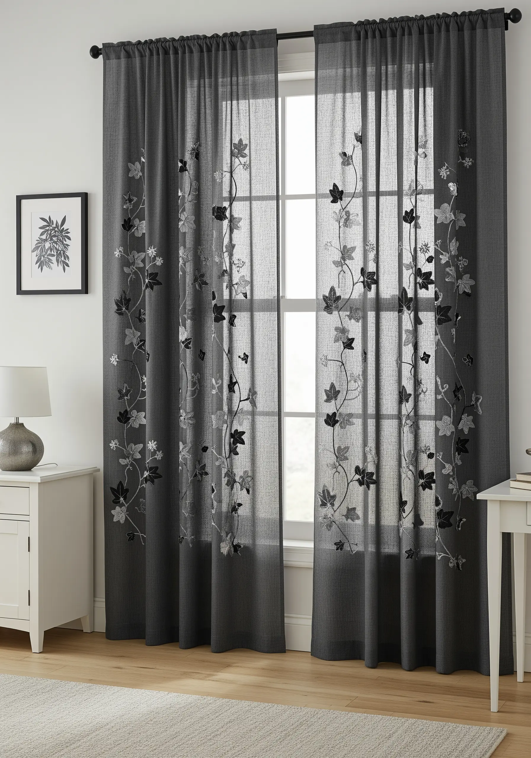 Black, charcoal, and silver ivy vines embroidered on sheer dark gray curtains.