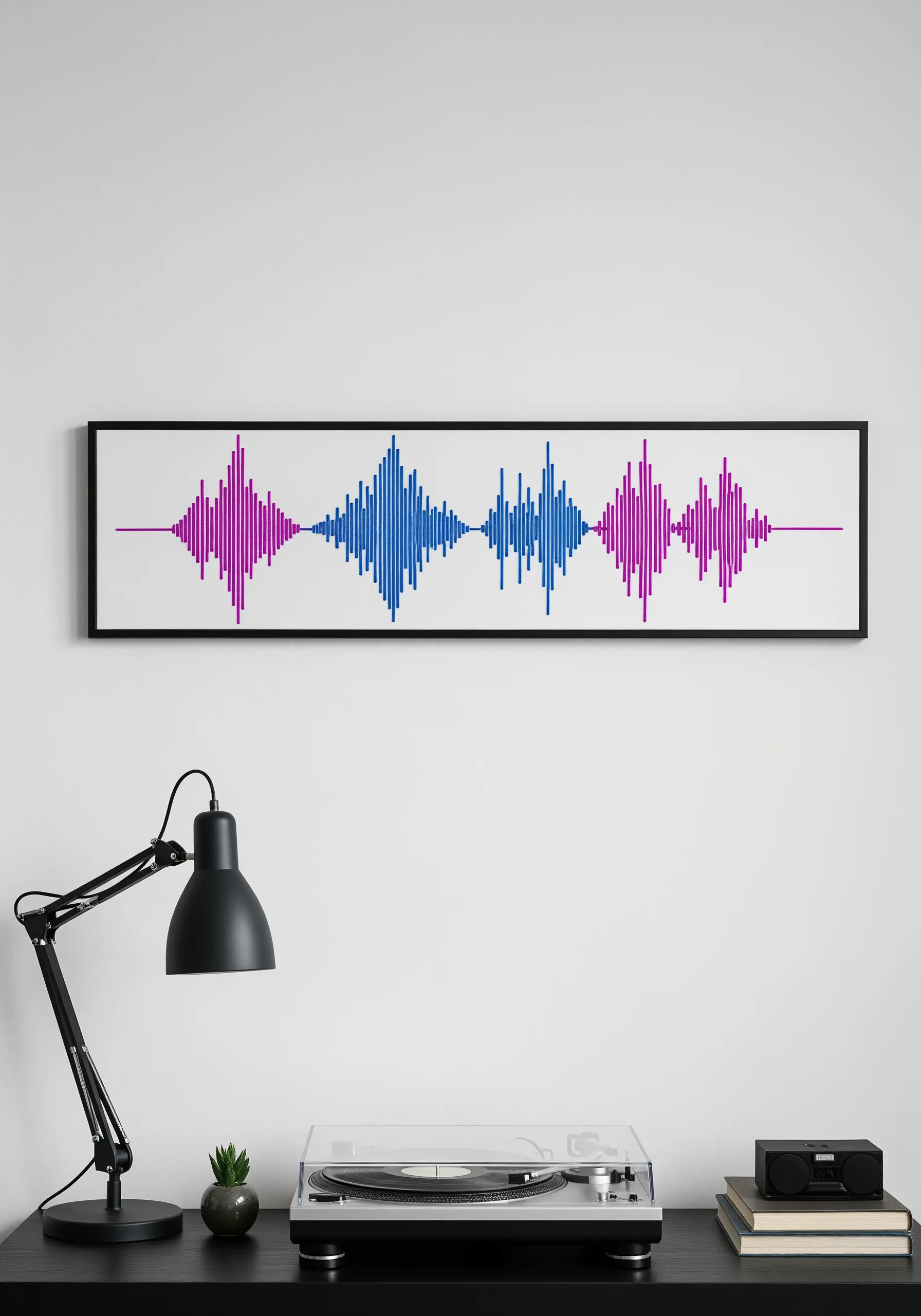 A framed piece of embroidery depicting a soundwave in blue and purple thread.