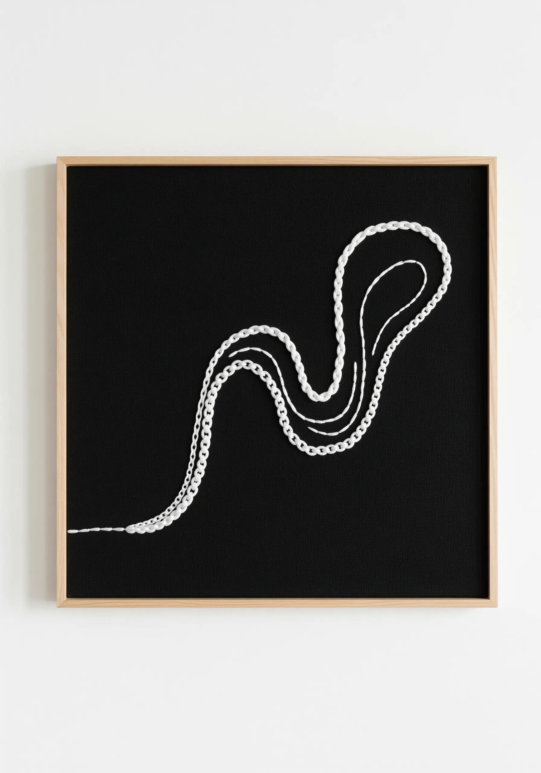 A minimalist design of a single, flowing white line embroidered on black fabric, framed.