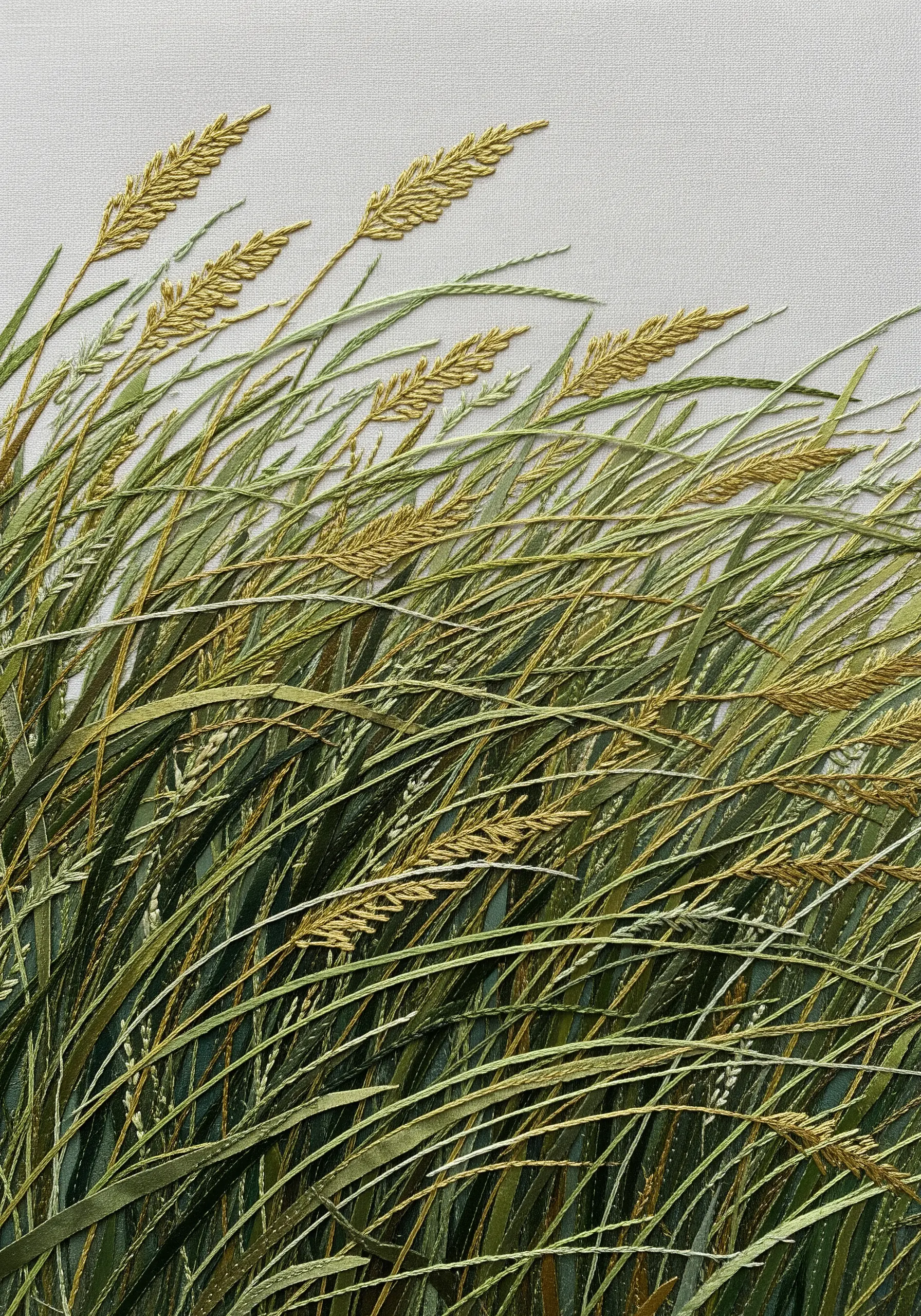 Tall blades of grass embroidered with flat green and yellow silk ribbon.