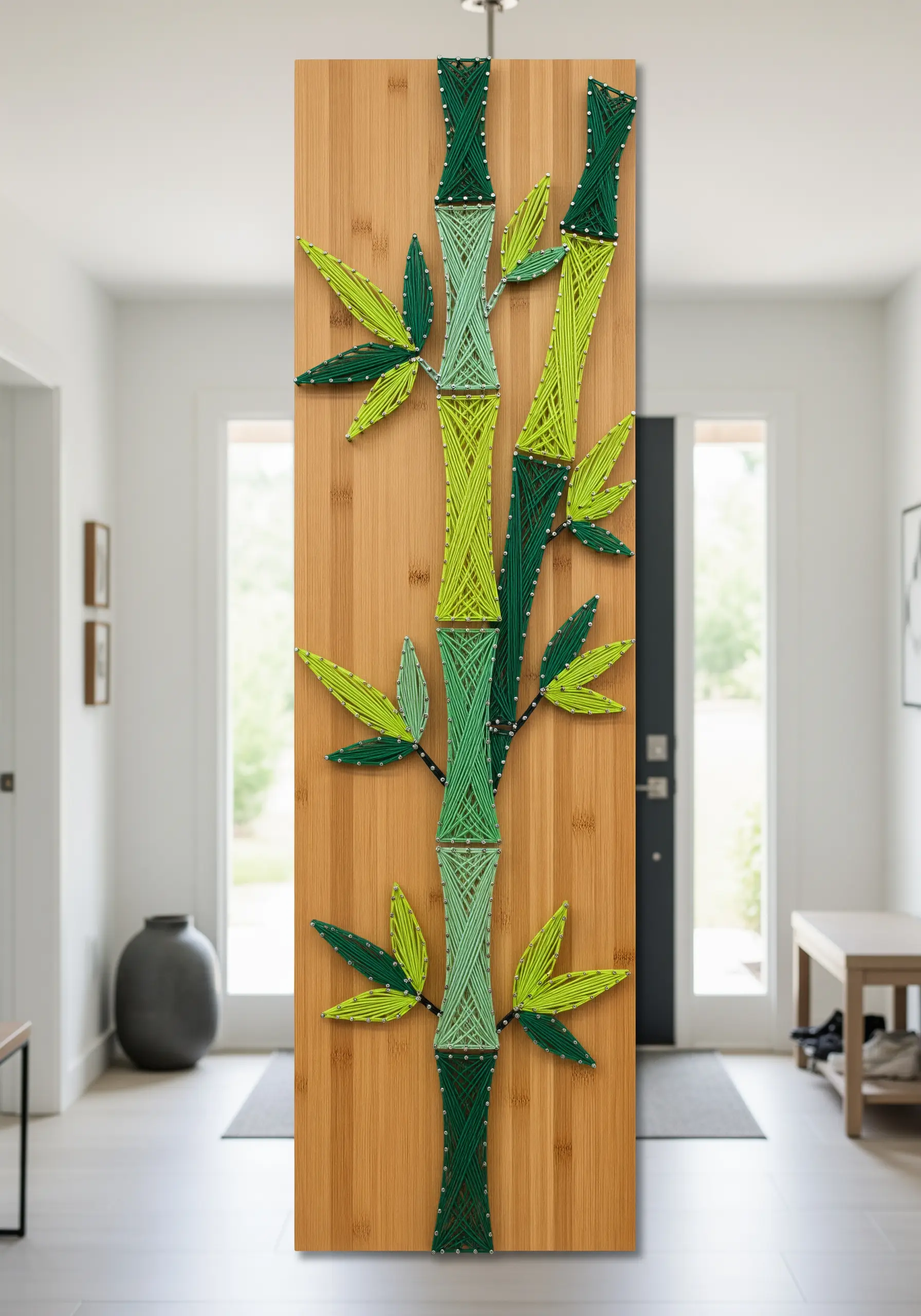 Modern string art of bamboo stalks on a wooden panel, using shades of green thread.