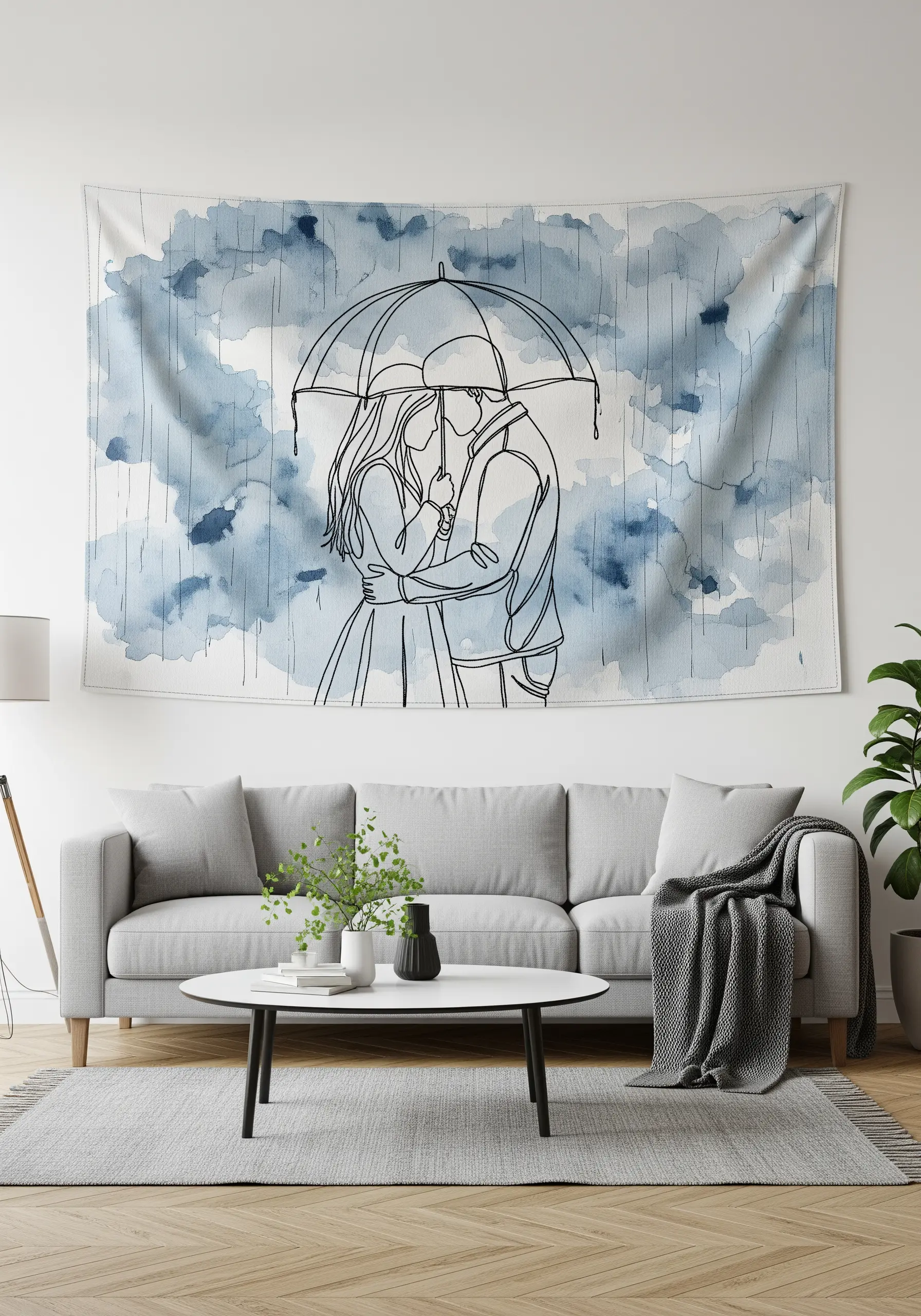 A large wall tapestry with a blue watercolor background featuring a simple line embroidery of a couple.