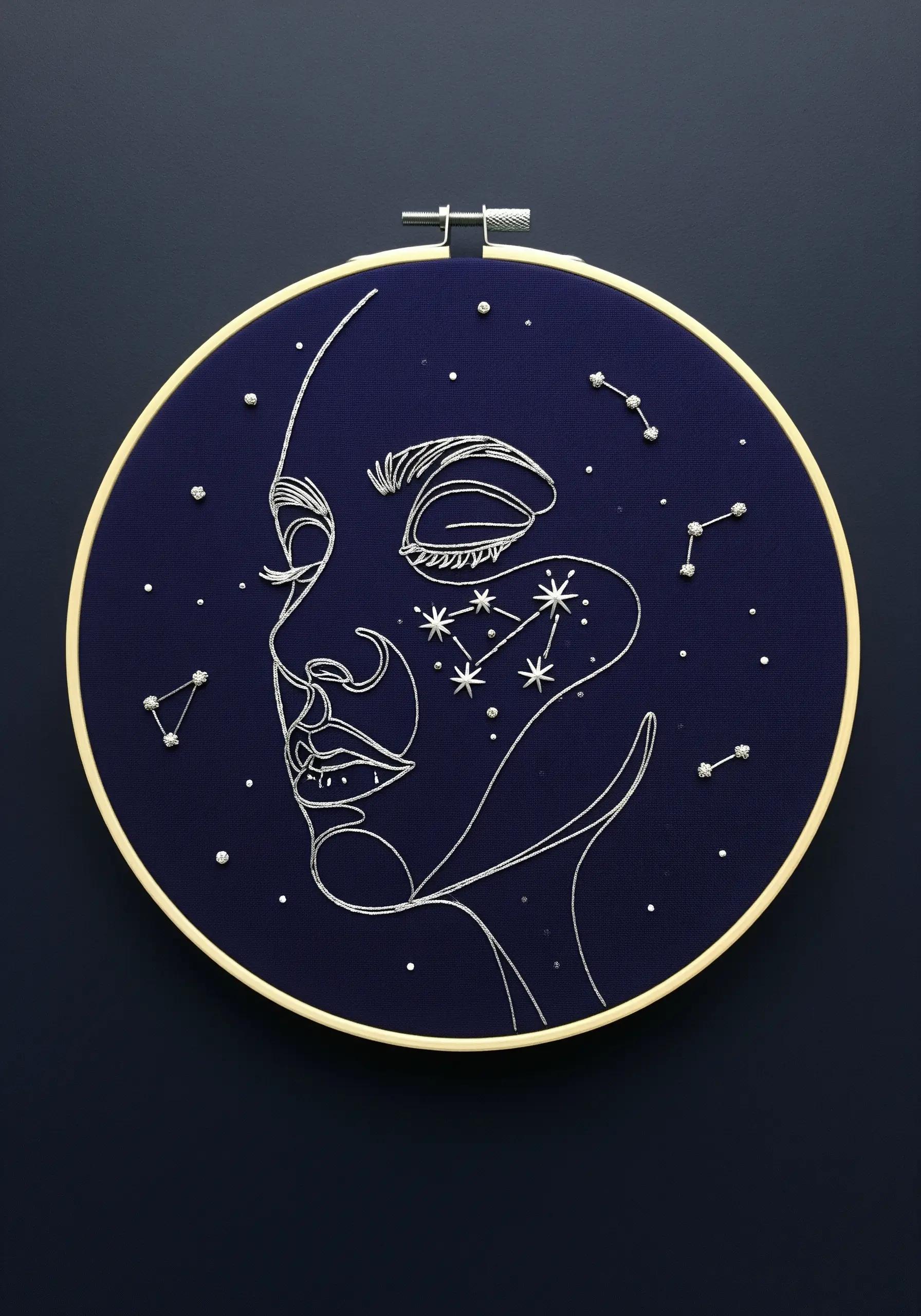 Celestial portrait with silver thread constellations and French knot stars.