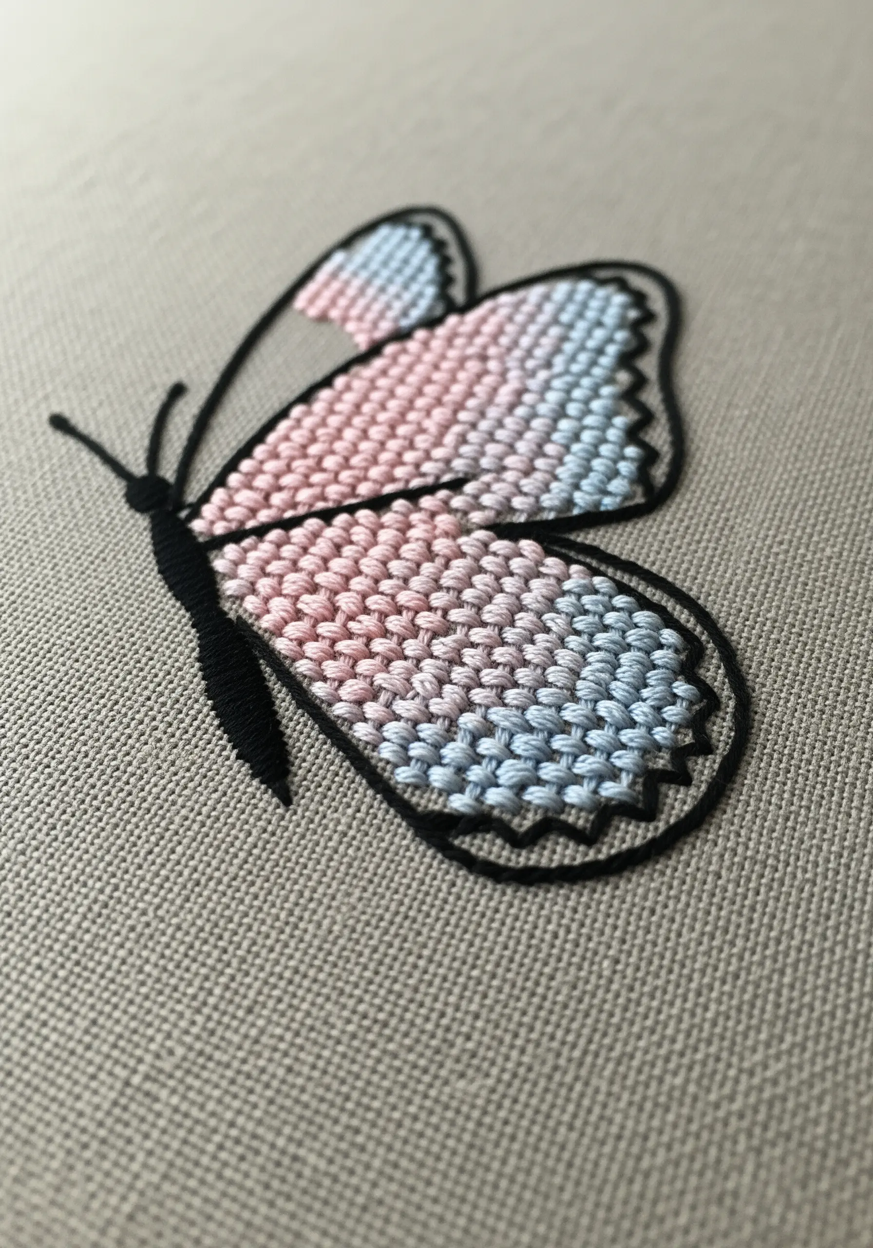 Butterfly embroidery featuring a woven brick stitch gradient pattern