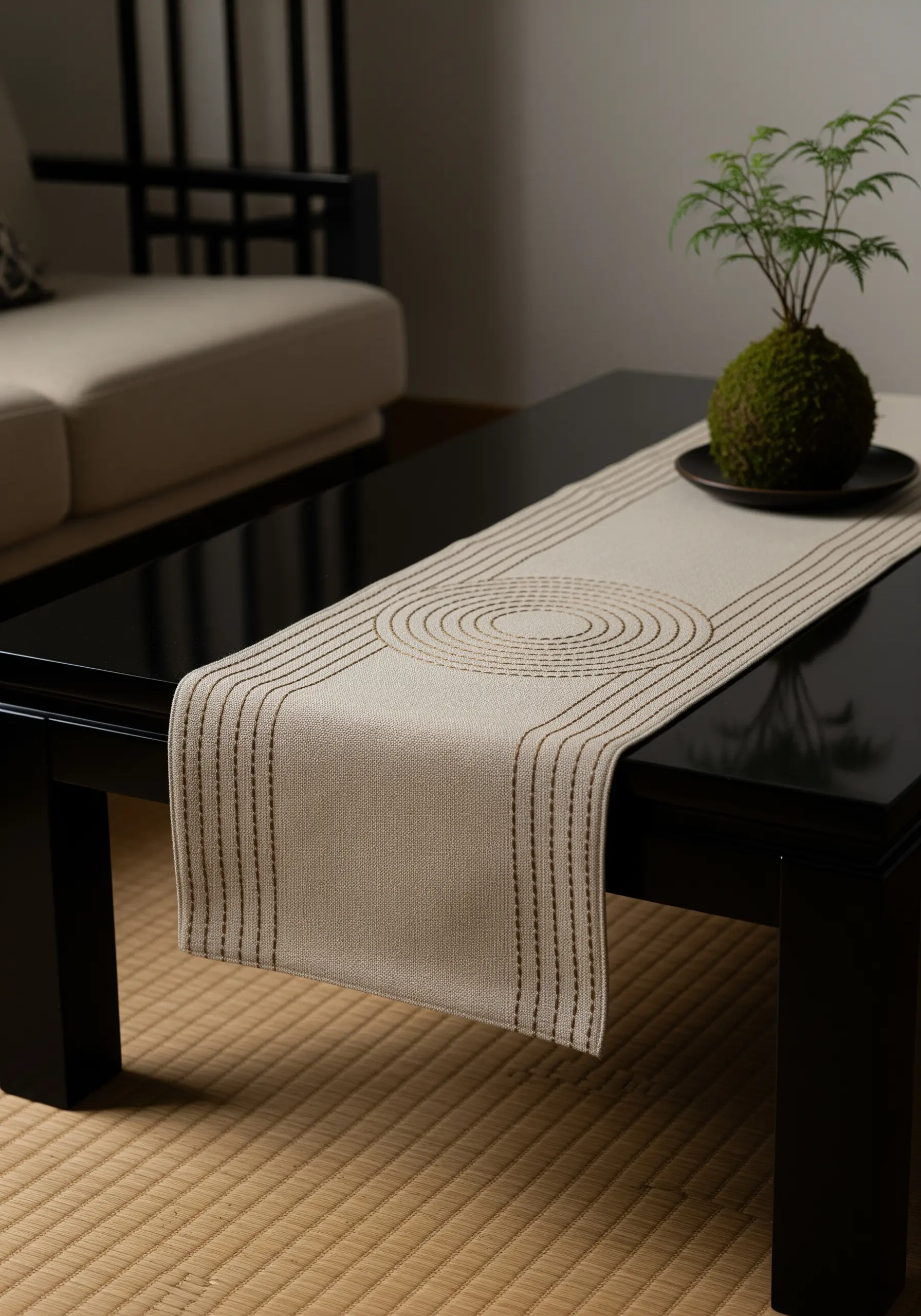 Minimalist table runner with concentric ovals and parallel lines in running stitch.