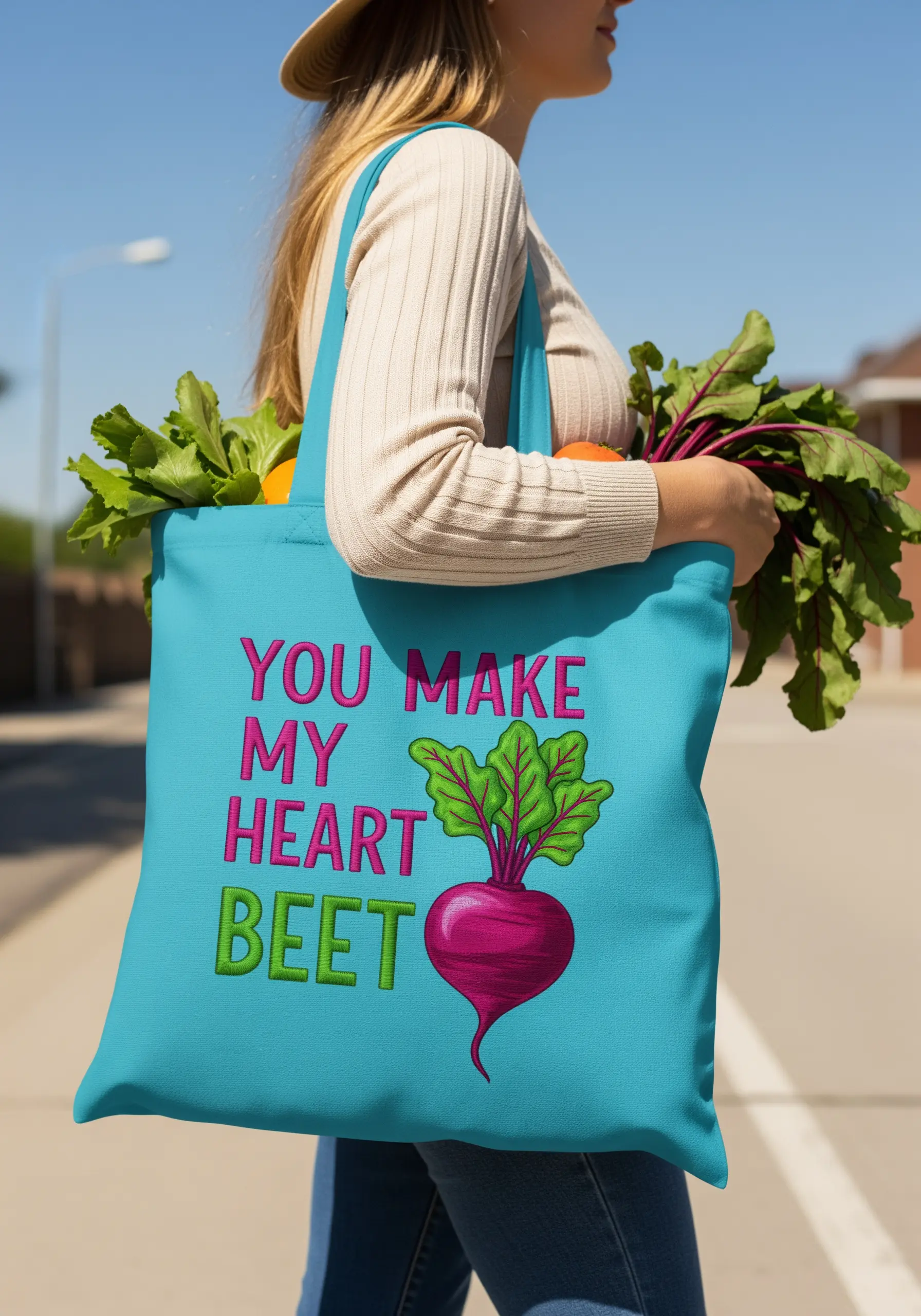 Bright blue tote bag with the pun 'You make my heart beet' and a large embroidered beet.