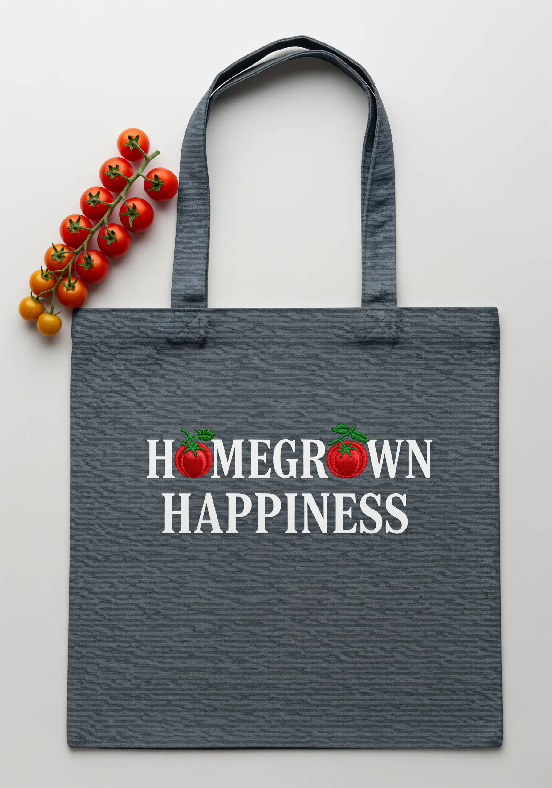 Charcoal grey tote bag with 'Homegrown Happiness' embroidered in a white serif font.
