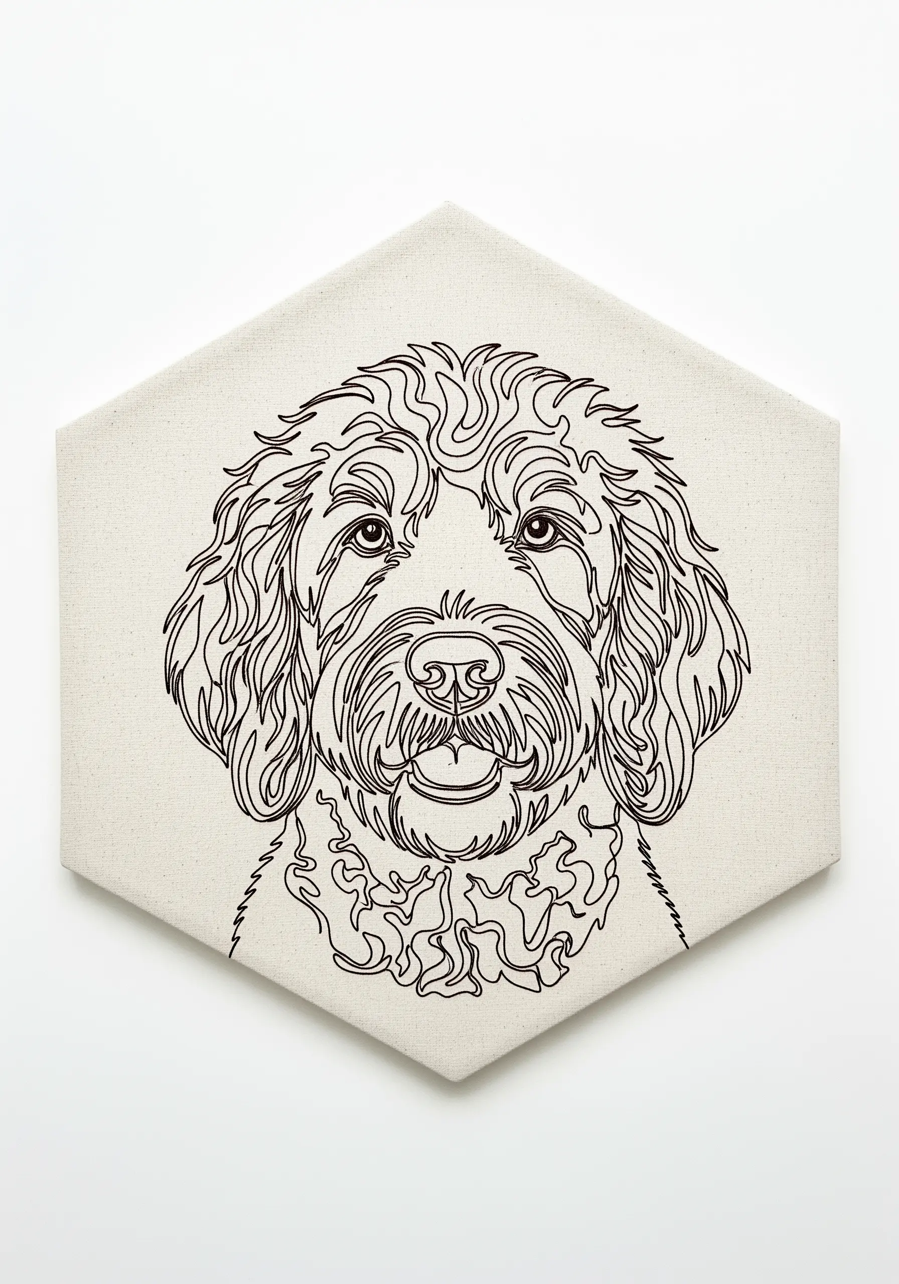 A continuous line art portrait of a Labradoodle stitched on a hexagon-shaped canvas.