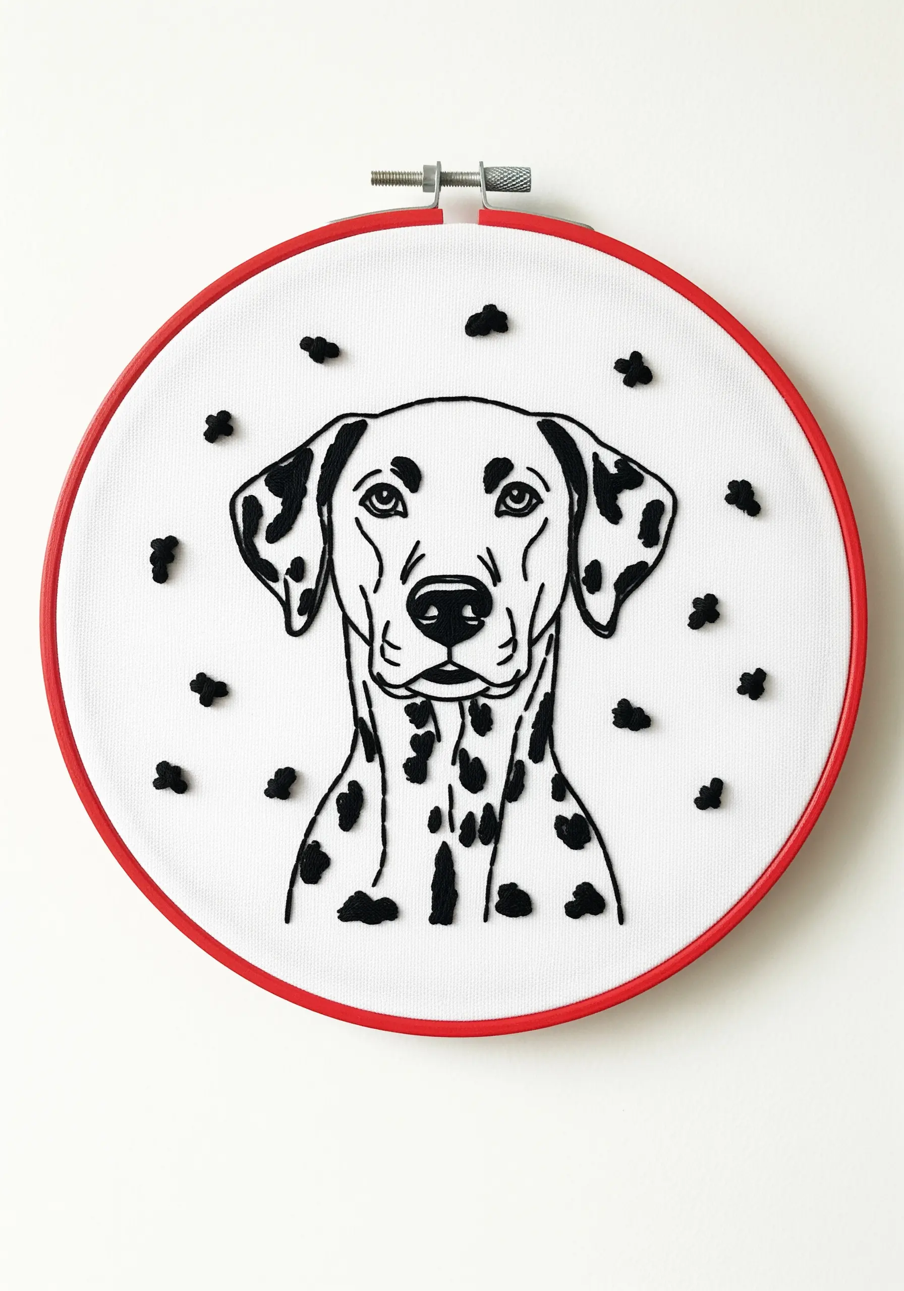 An embroidered Dalmatian portrait with its characteristic spots stitched as floating French knots.