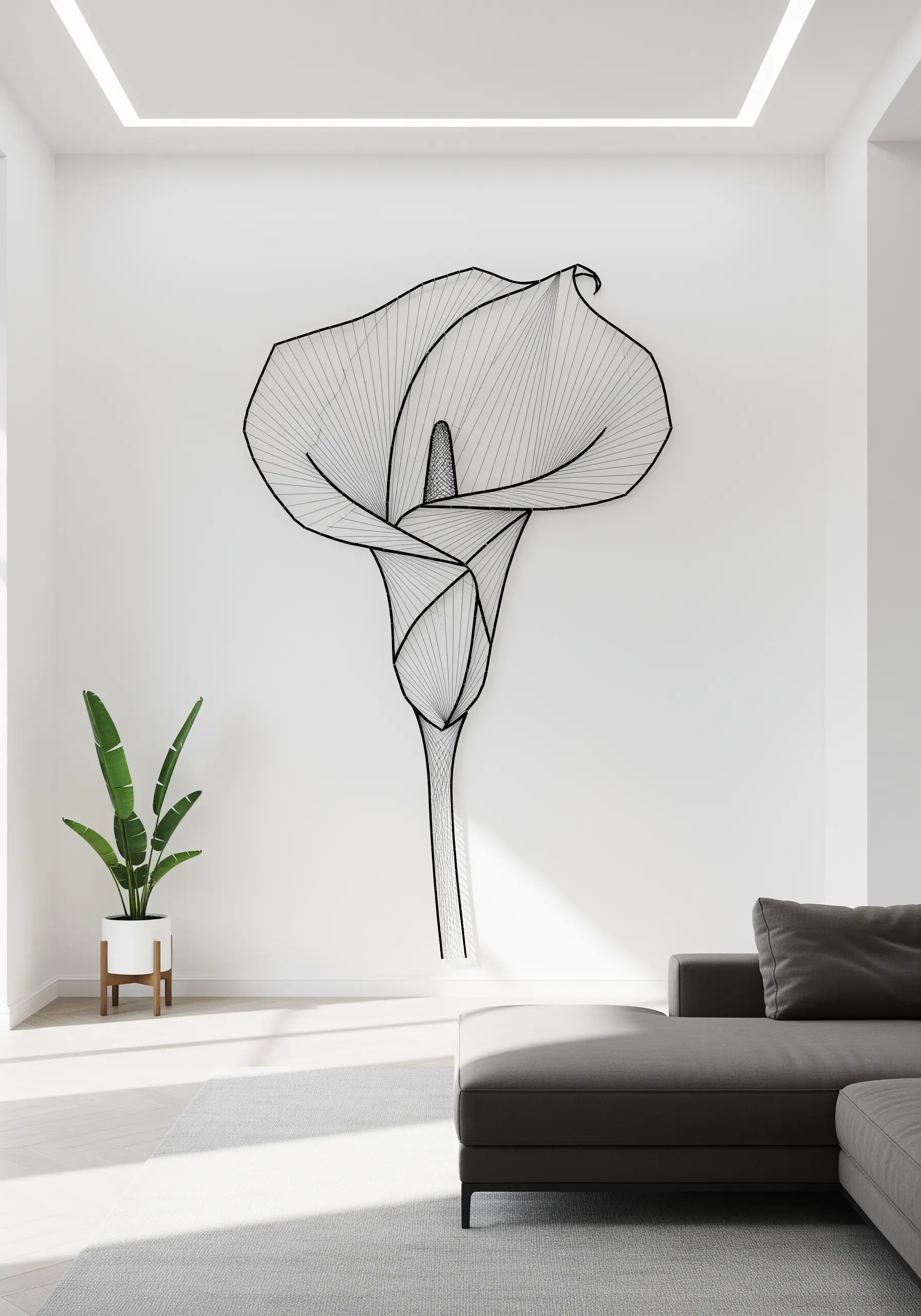 Minimalist black line string art of a single calla lily on a large white wall.