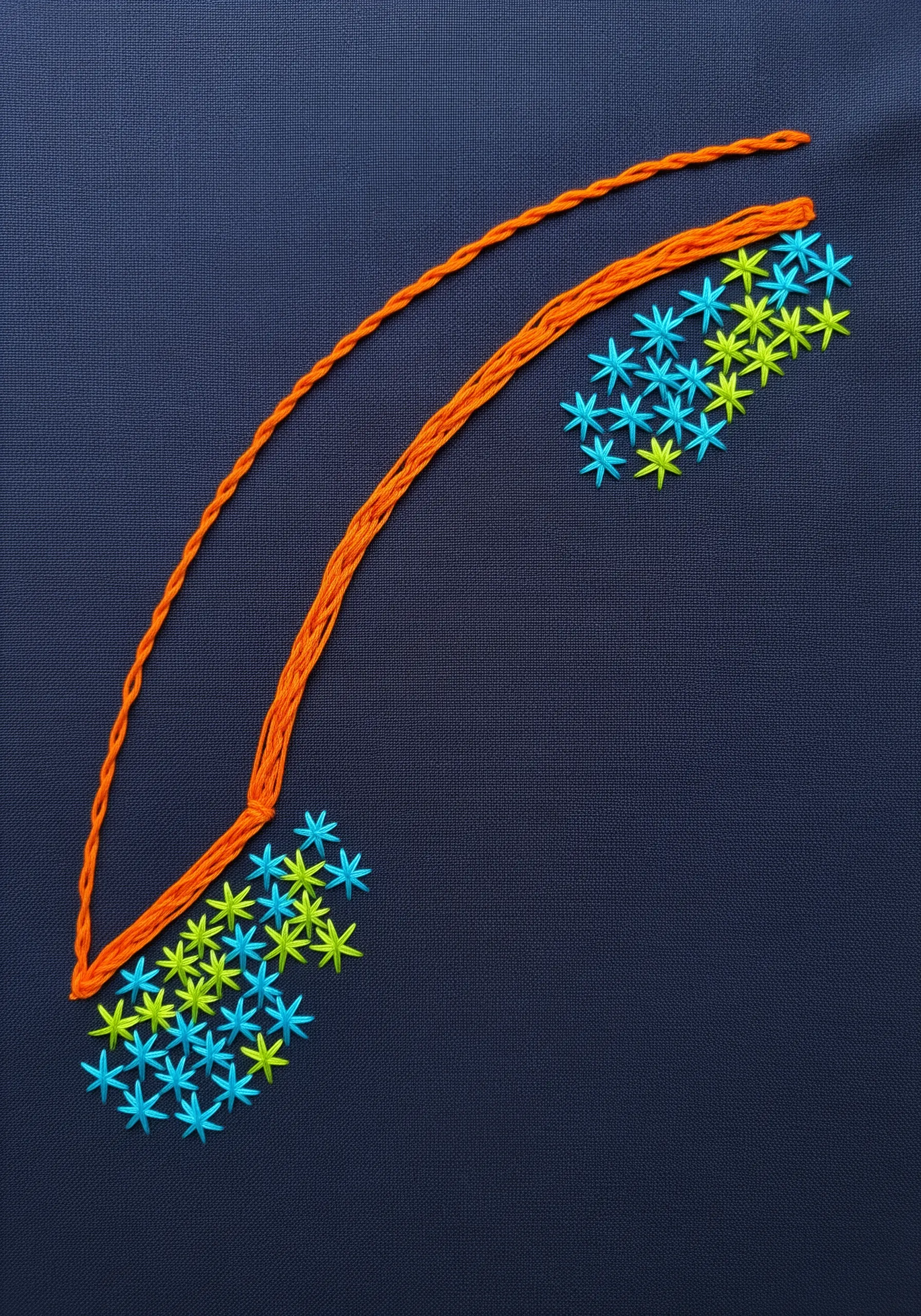 Clusters of small, bright blue and yellow-green star stitches on a dark navy blue fabric.